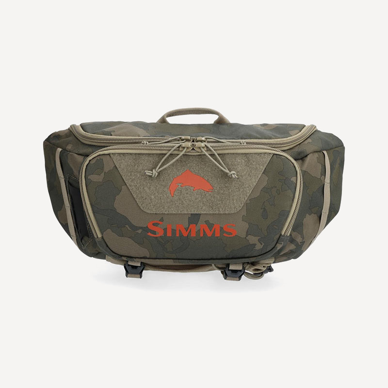 Сумка Simms Tributary Hip Pack 5L (Regiment Camo Olive Drab; 5л) Сумка Simms Tributary Hip Pack 5L (Regiment Camo Olive Drab; 5л)